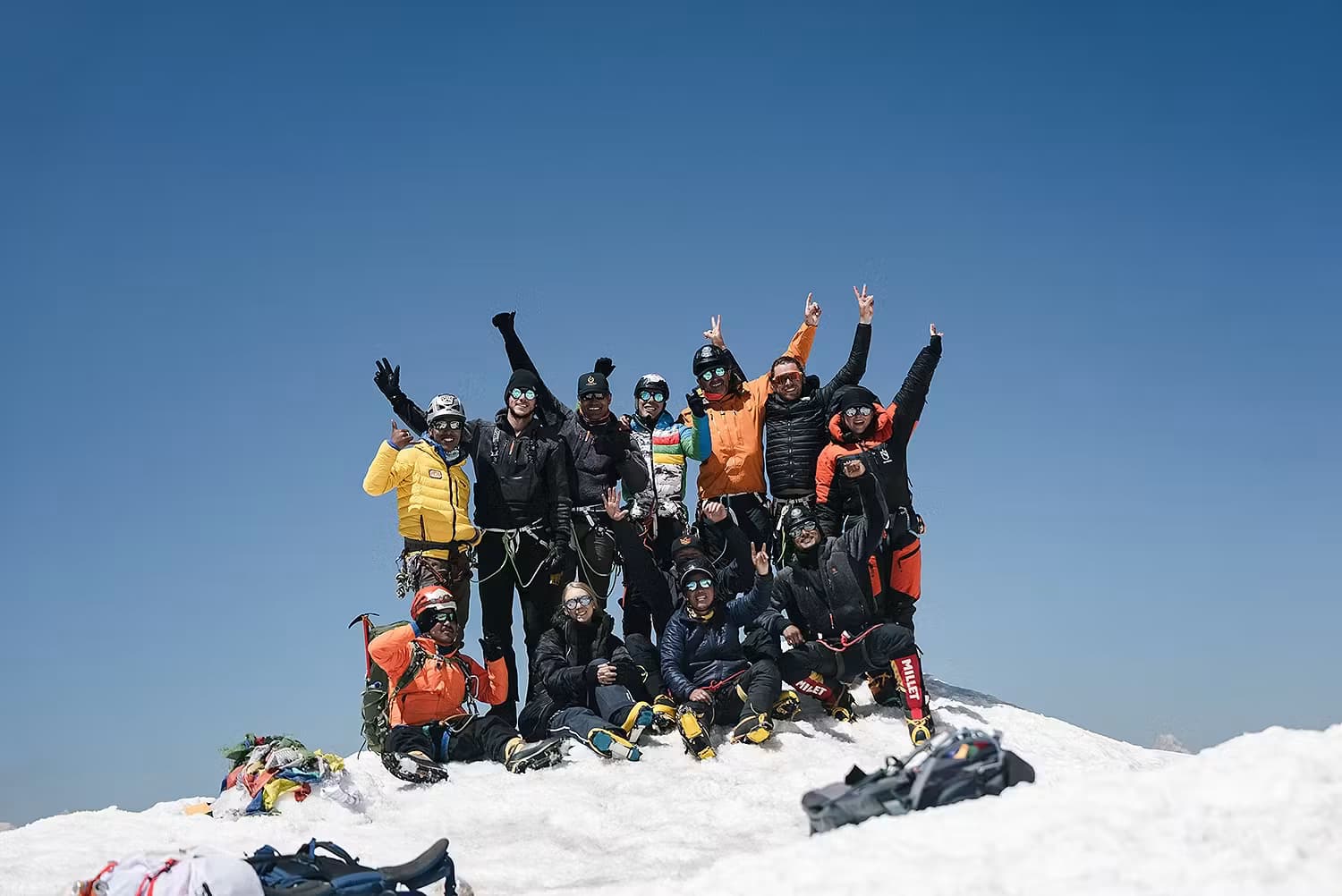 Expedition team celebrating together on the mountain